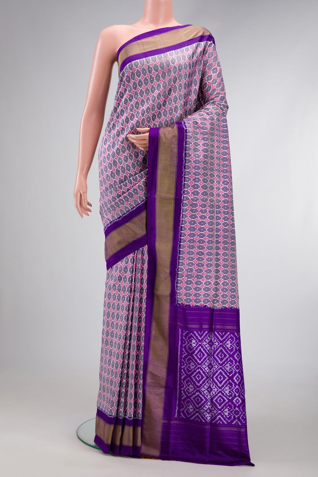 Grey Dual Tone Double Ikat Saree with Ikat Print on the body and Zari Border.  displayed on a mannequin