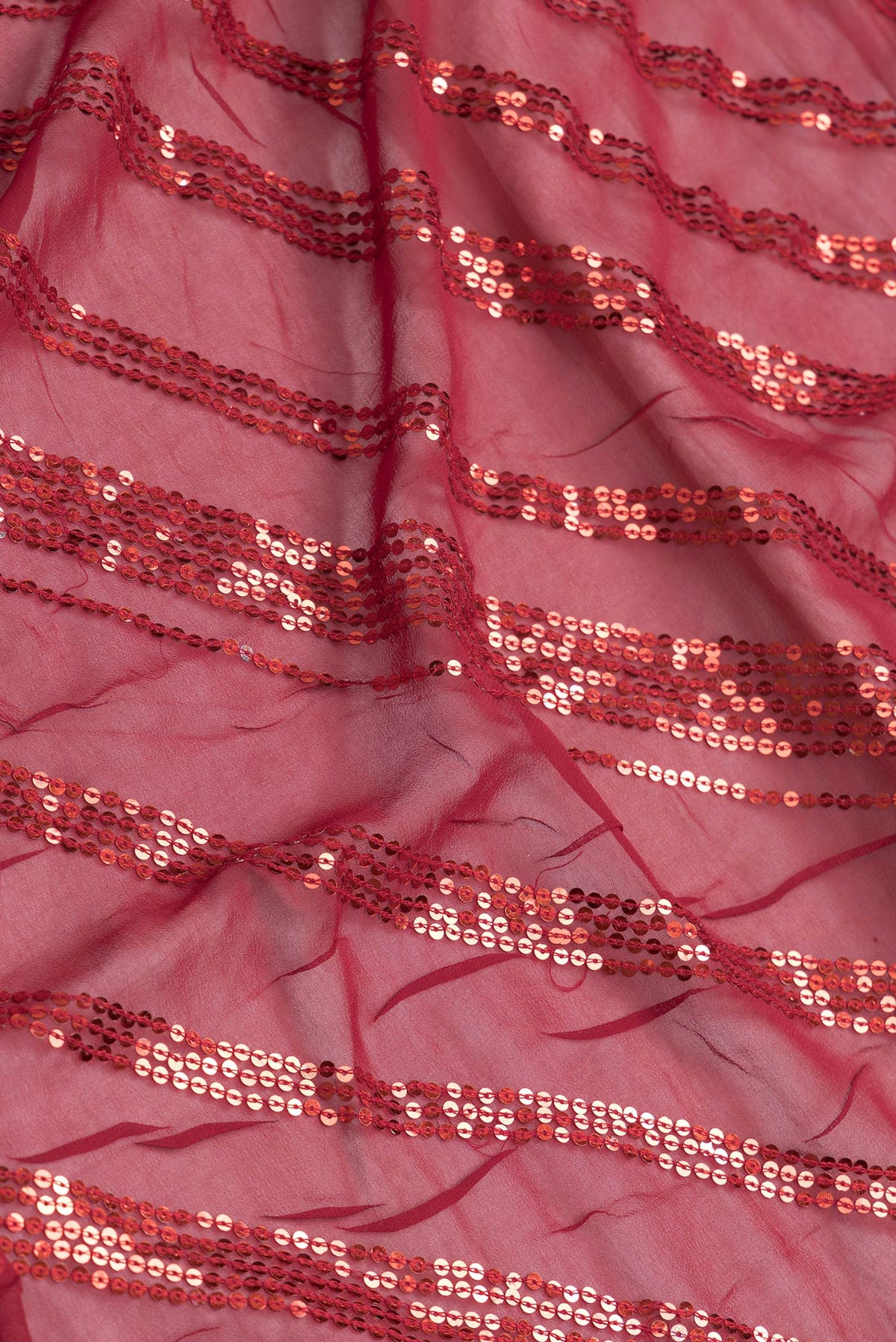 Close up of Maroon Dual Tone Mysore Georgette Saree with Embroidery on the body and Embroidery Border.  displaying folds