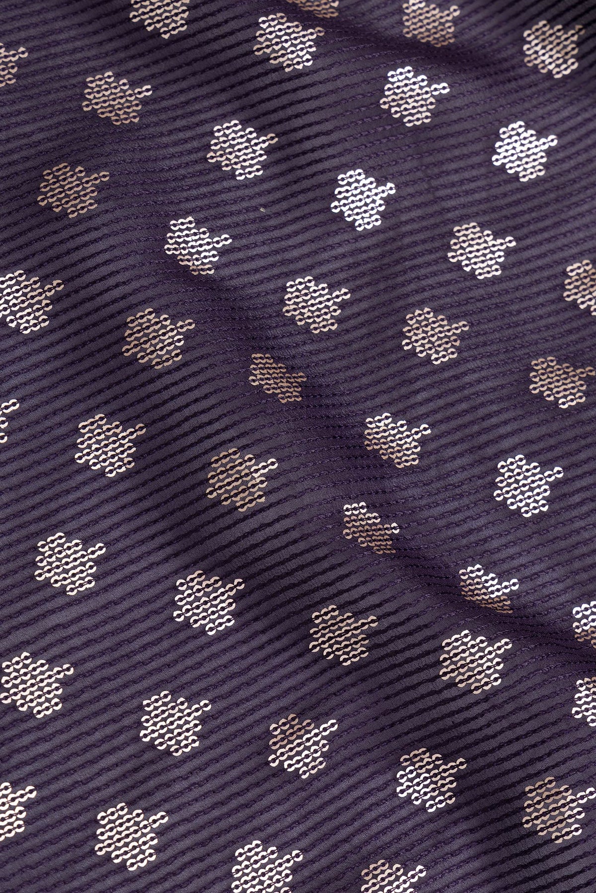 Close up of Violet Dual Tone Georgette Saree with Embroidery on the body and Embroidery Border.  displaying folds