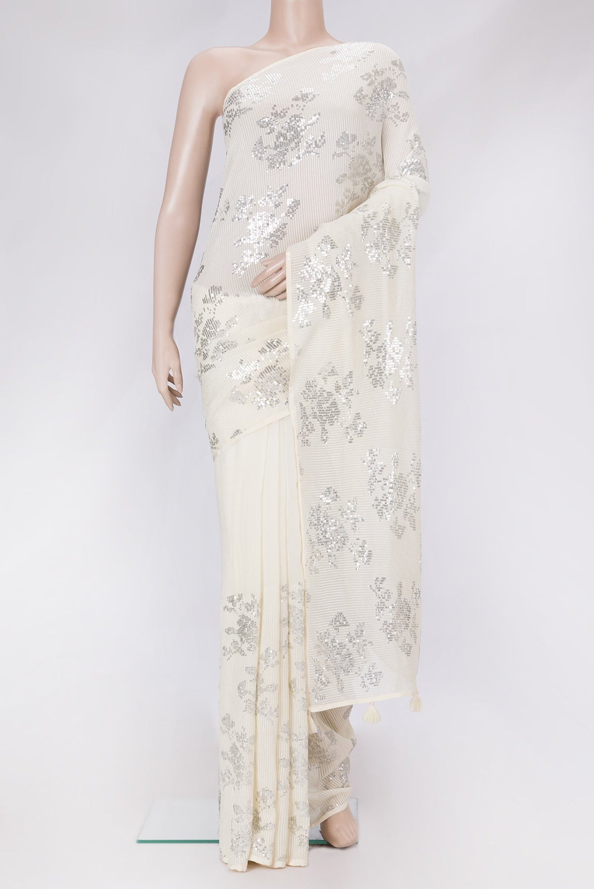 Beige Dual Tone Mysore Georgette Saree with Embroidery on the body and Without Border.  displayed on a mannequin
