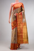 Gold Dual Tone Kanjivaram Tissue Silk Saree with Zari Brocade on the body and Zari Border.  displayed on a mannequin