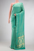 Sea Green Dual Tone Banarasi Georgette Saree with Zari Brocade on the body and Zari Border.  displayed on a mannequin