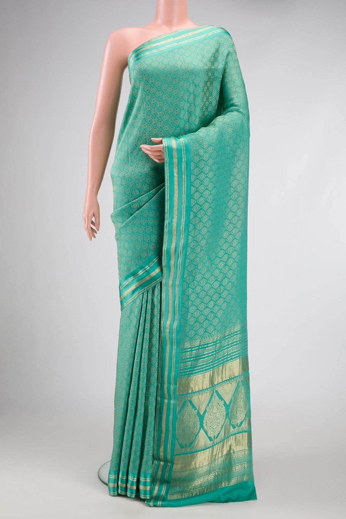 Sea Green Dual Tone Banarasi Georgette Saree with Zari Brocade on the body and Zari Border.  displayed on a mannequin