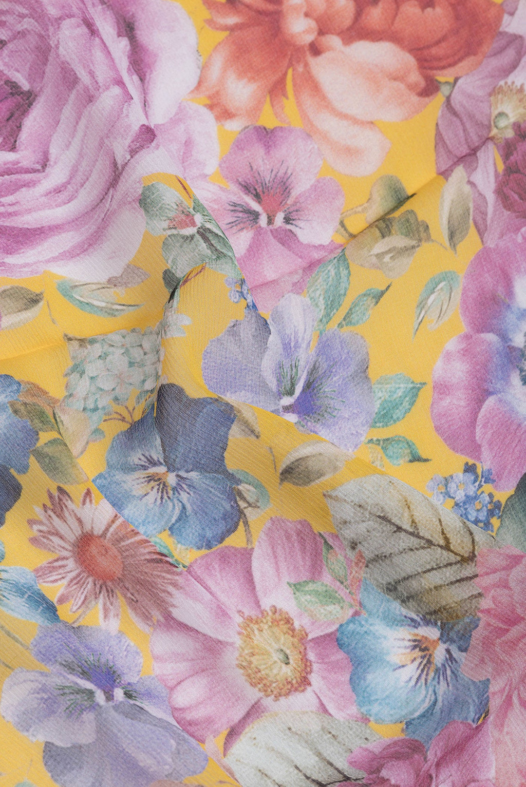 Close up of Yellow Mysore Chiffon Saree with Printed design on the body and Plain Border.  displaying folds