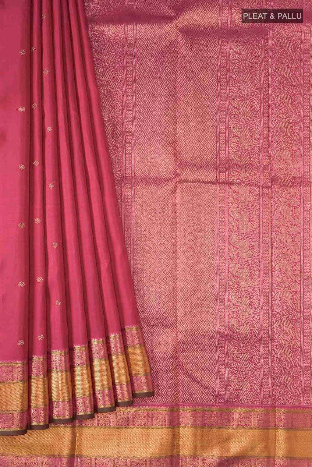 Pleats and pallu of Red Kanchipuram Silk Saree with Zari Butta on the body and Zari Border