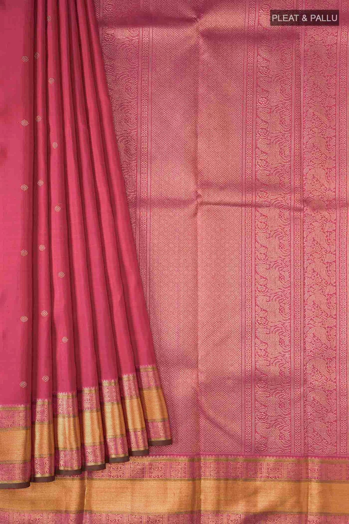 Pleats and pallu of Red Kanchipuram Silk Saree with Zari Butta on the body and Zari Border