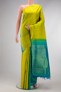 Yellow Dual Tone Kanjivaram Silk Saree with Half And Half on the body and Without Border.  displayed on a mannequin