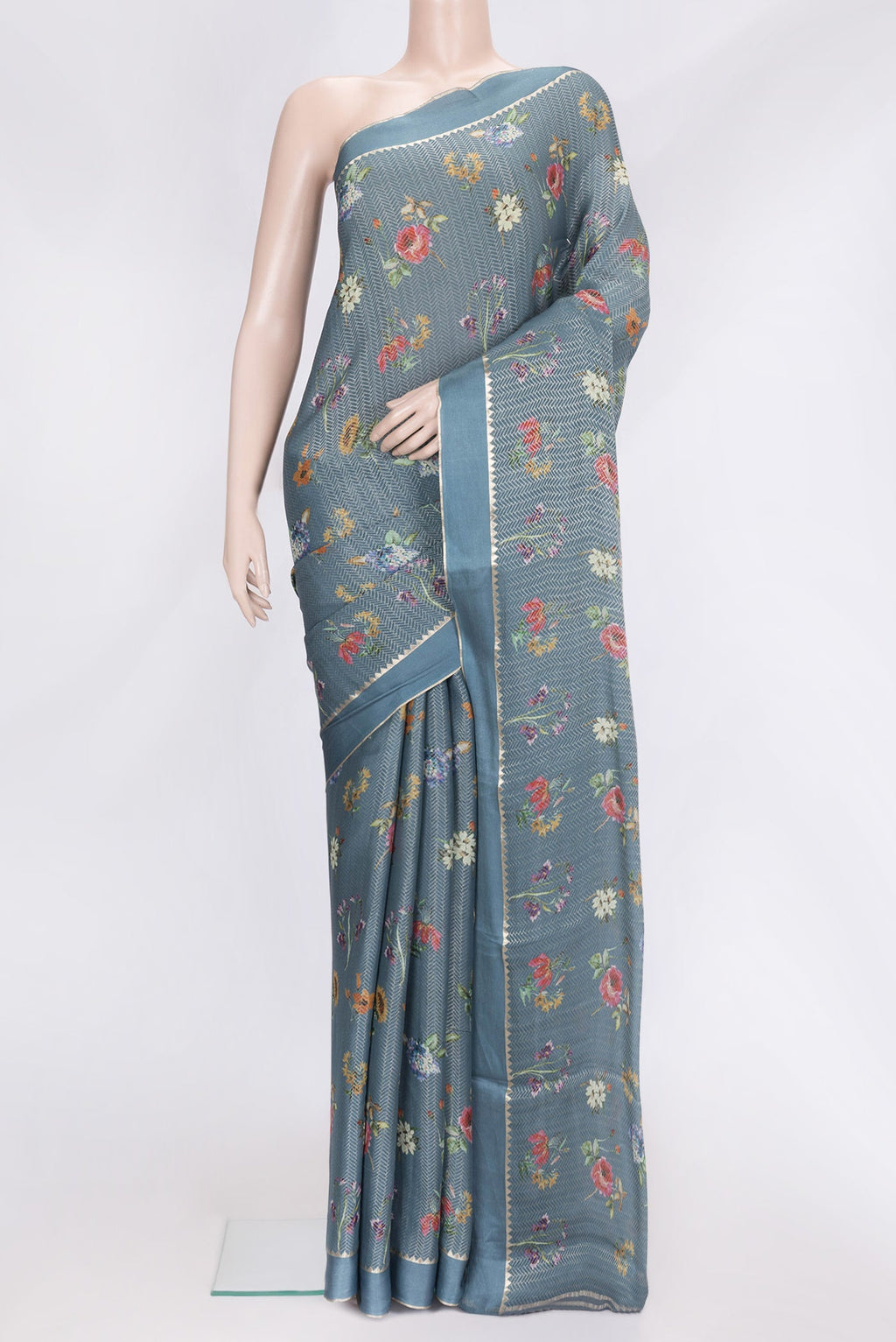 Grey Dual Tone Georgette Saree with Zari Brocade on the body and Zari Border.  displayed on a mannequin