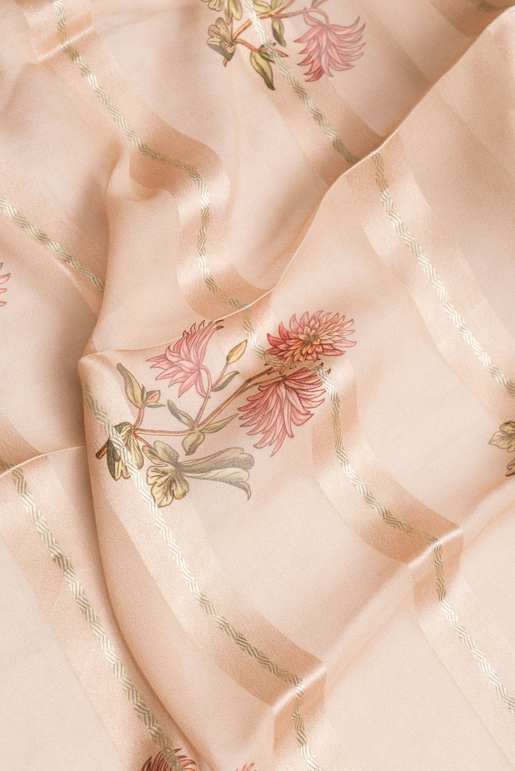 Close up of Peach Dual Tone Mysore Georgette Saree with Stripes on the body and Zari Border.  displaying folds