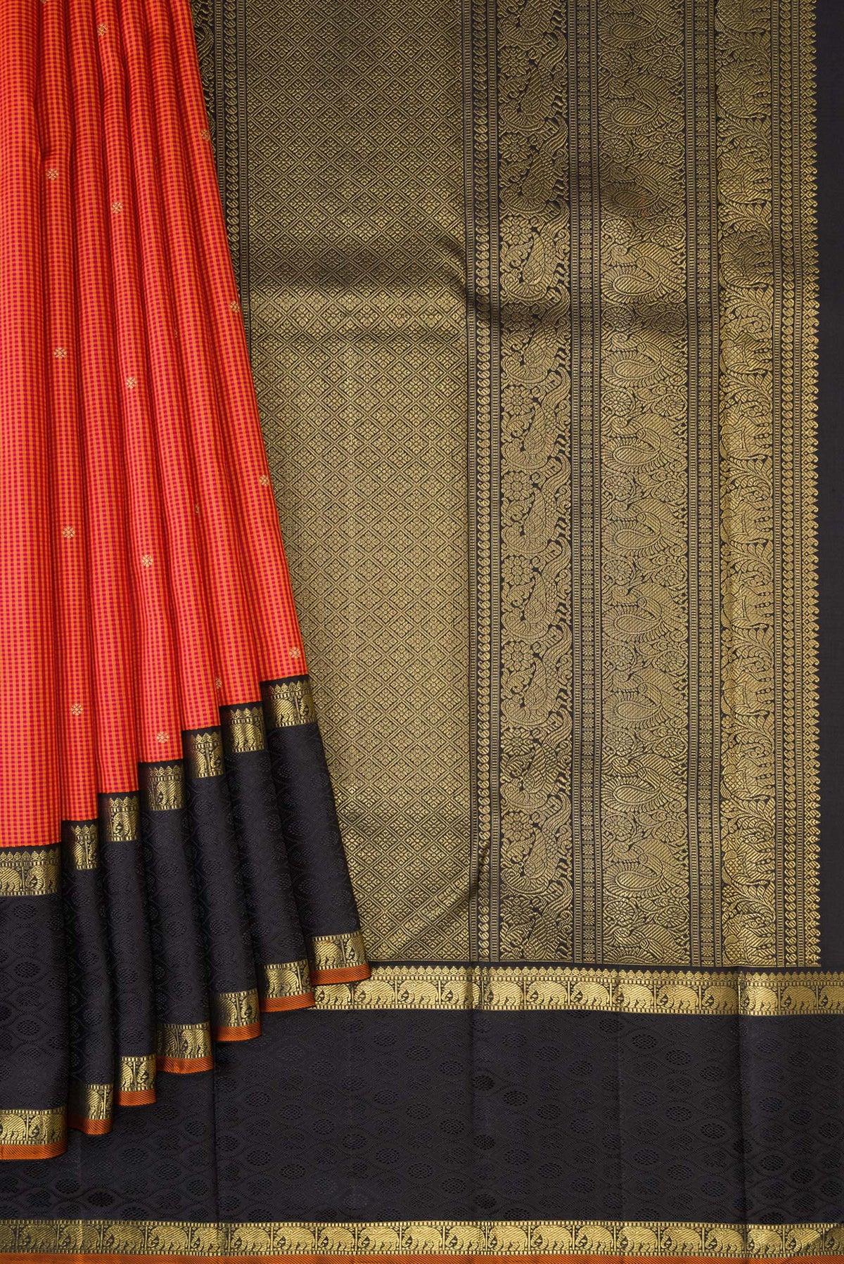 Pleats and pallu of Pure Silk Pure Zari Orange Dual Tone Kanchipuram Saree with Checked design on the body and Zari Border. 