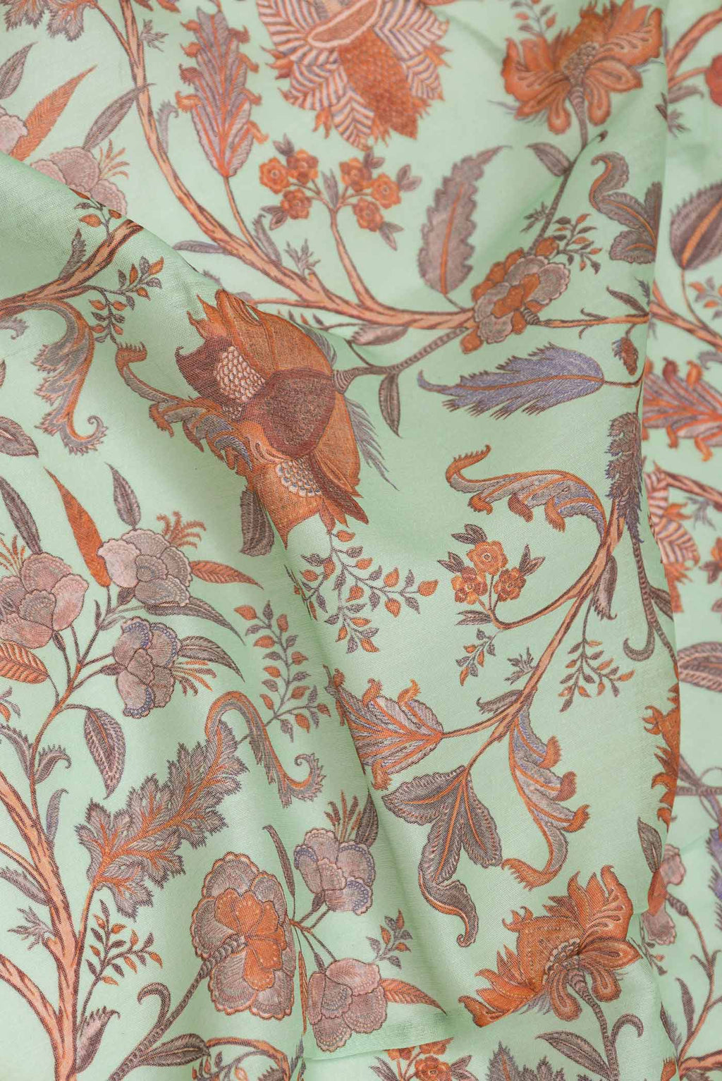 Close up of Sea Green Dual Tone Chanderi Silk Saree with Printed design on the body and Zari Border displaying folds