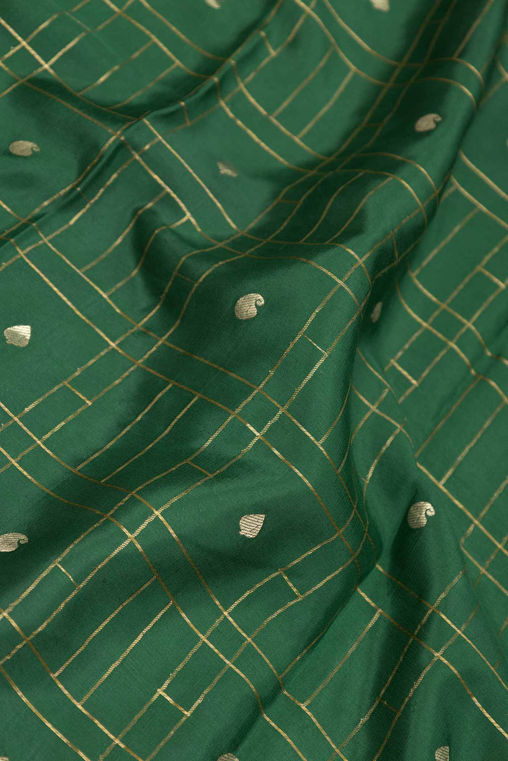 Close up of Green Dual Tone Mysore Crepe Saree with Checked design on the body and Zari Border displaying folds