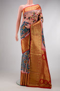Golden Peach Dual Tone Kanchipuram Silk Saree with kalamkari Print on the body and Zari Border.  displayed on a mannequin