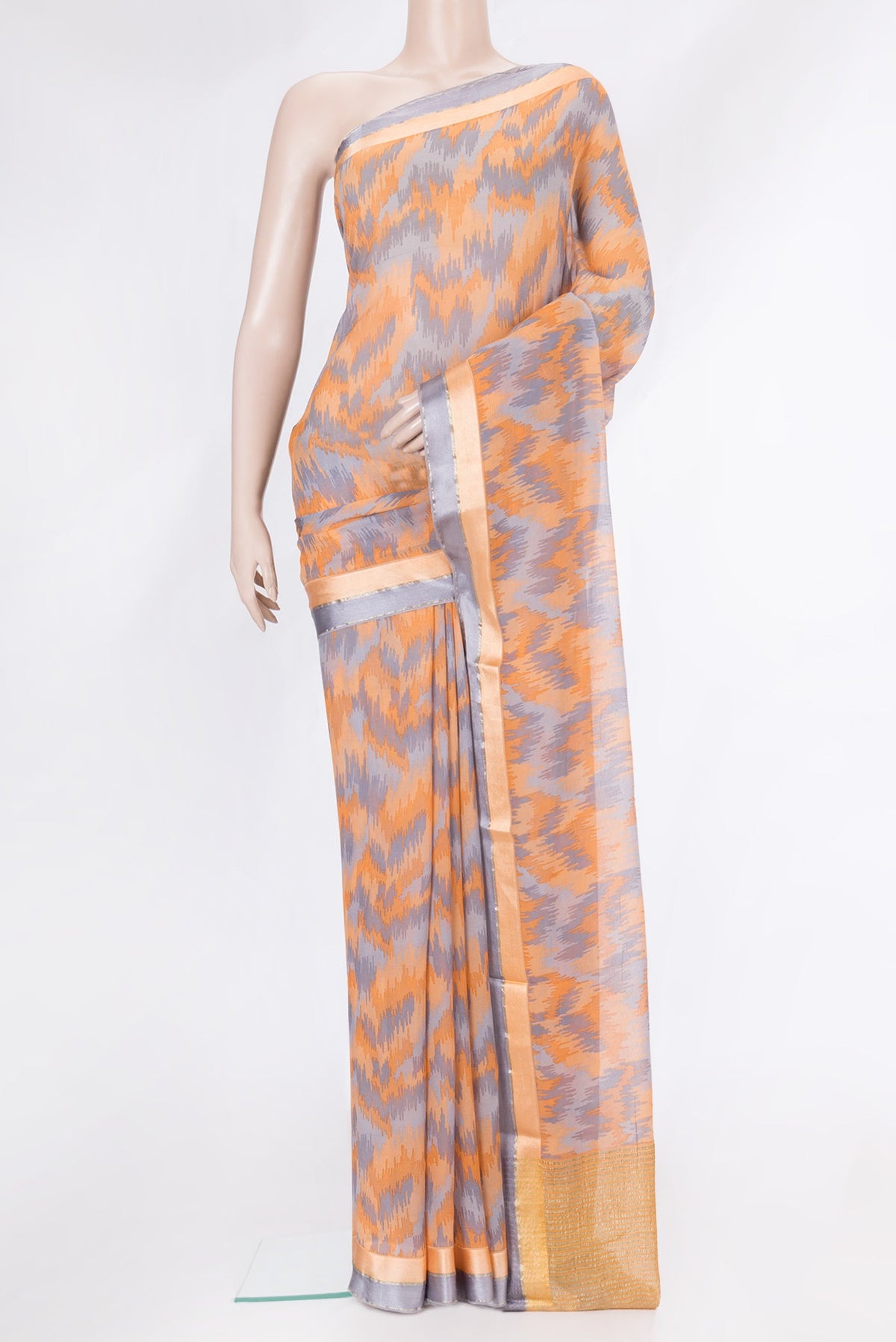 Orange Dual Tone Mysore Chiffon Saree with Printed design on the body and Zari Border.  displayed on a mannequin
