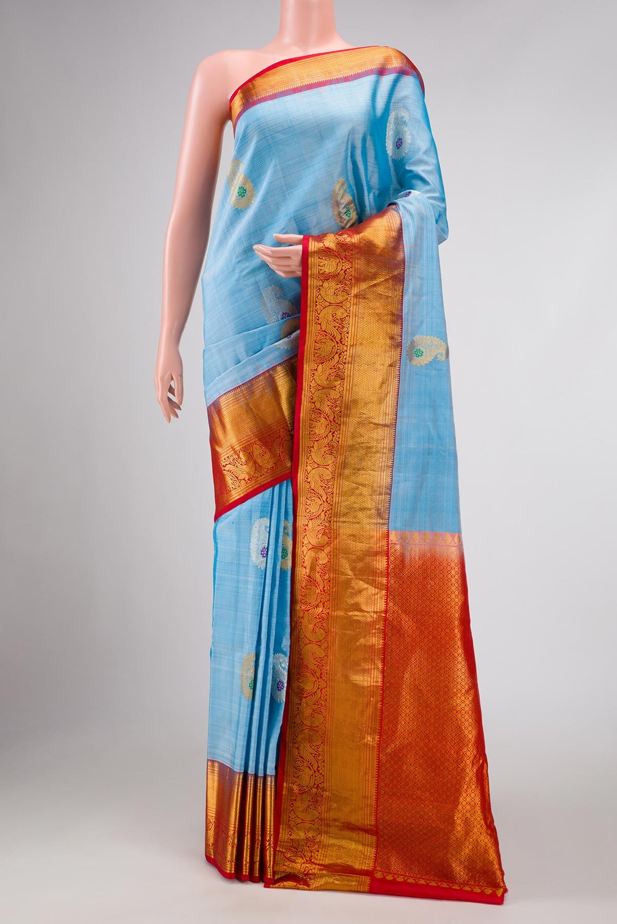 Light Blue Dual Tone Gadwal Silk Saree with Zari Butta on the body and Zari Border displayed on a mannequin