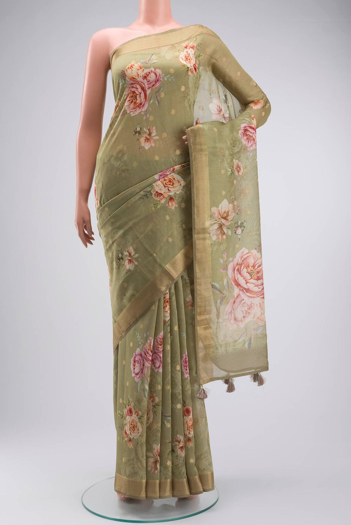 Green Silk Cotton Saree with Printed design on the body and Zari Border displayed on a mannequin