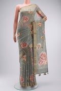 Sage Green Silk Cotton Saree with Printed design on the body and Zari Border displayed on a mannequin