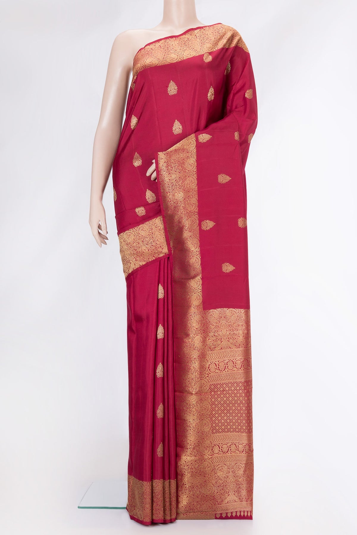 Maroon Dual Tone Kanjivaram Silk Saree with Zari Butta on the body and Zari Border.  displayed on a mannequin
