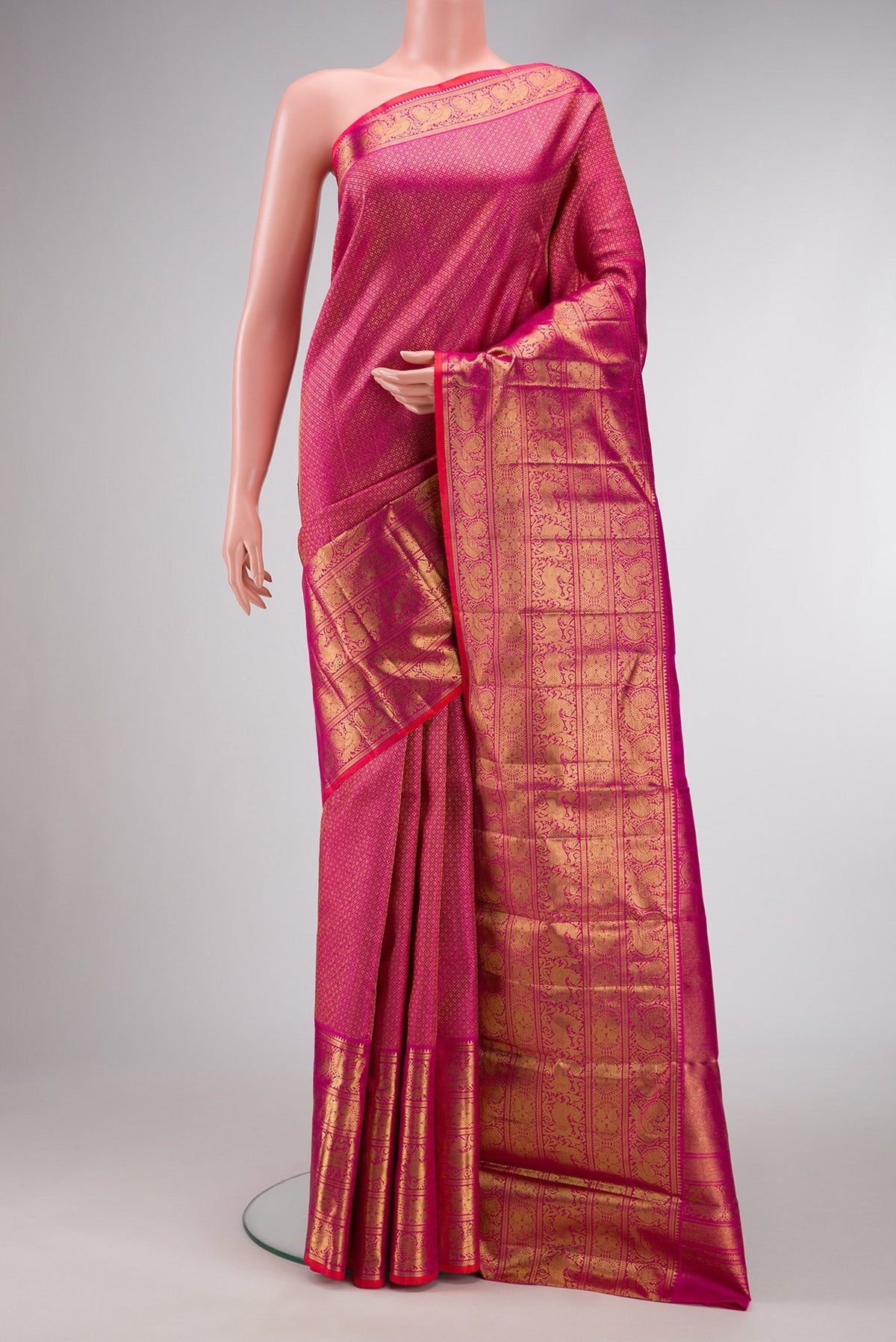 Pure Silk Pure Zari Magenta Dual Tone Kanjivaram Saree with Zari Brocade on the body and Zari Border.  displayed on a mannequin