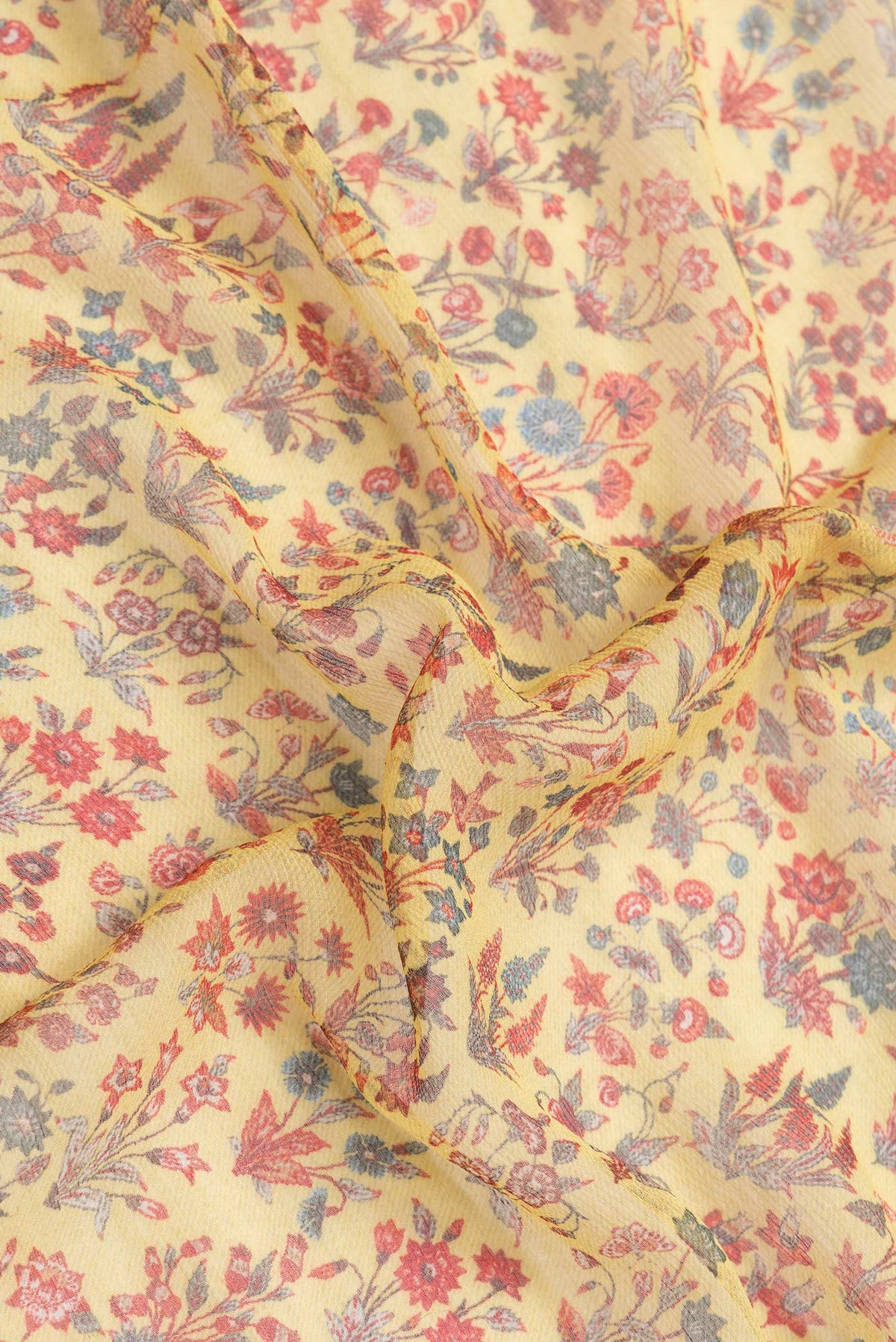Close up of Yellow Dual Tone Mysore Chiffon Saree with Printed design on the body and Zari Border.  displaying folds