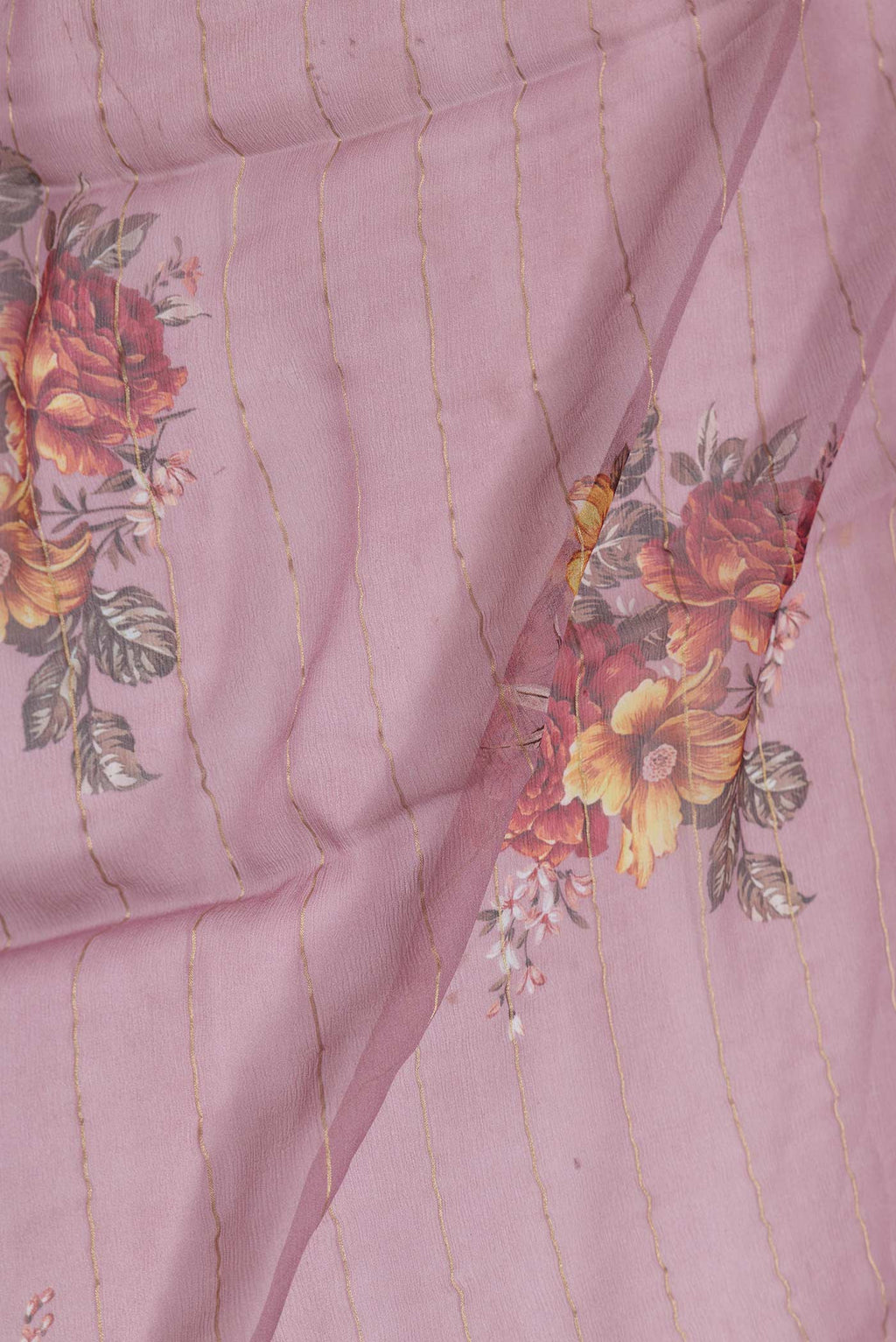 Close up of Pink Dual Tone Mysore Chiffon Saree with Printed design on the body and Zari Border displaying folds