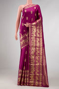 Magenta Dual Tone Kanchipuram Silk Saree with Zari Butta on the body and Fancy Border displayed on a mannequin