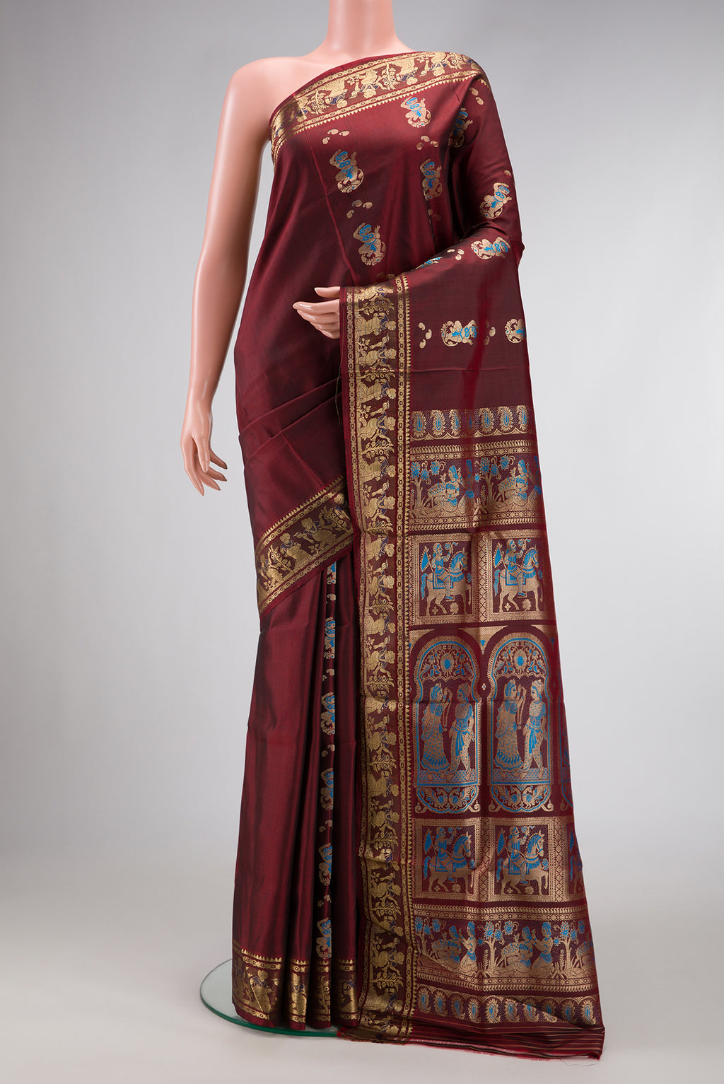 Coffee Brown Baluchari Silk Saree with Thread Butta on the body and Zari Border.  displayed on a mannequin