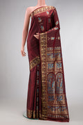 Coffee Brown Baluchari Silk Saree with Thread Butta on the body and Zari Border.  displayed on a mannequin