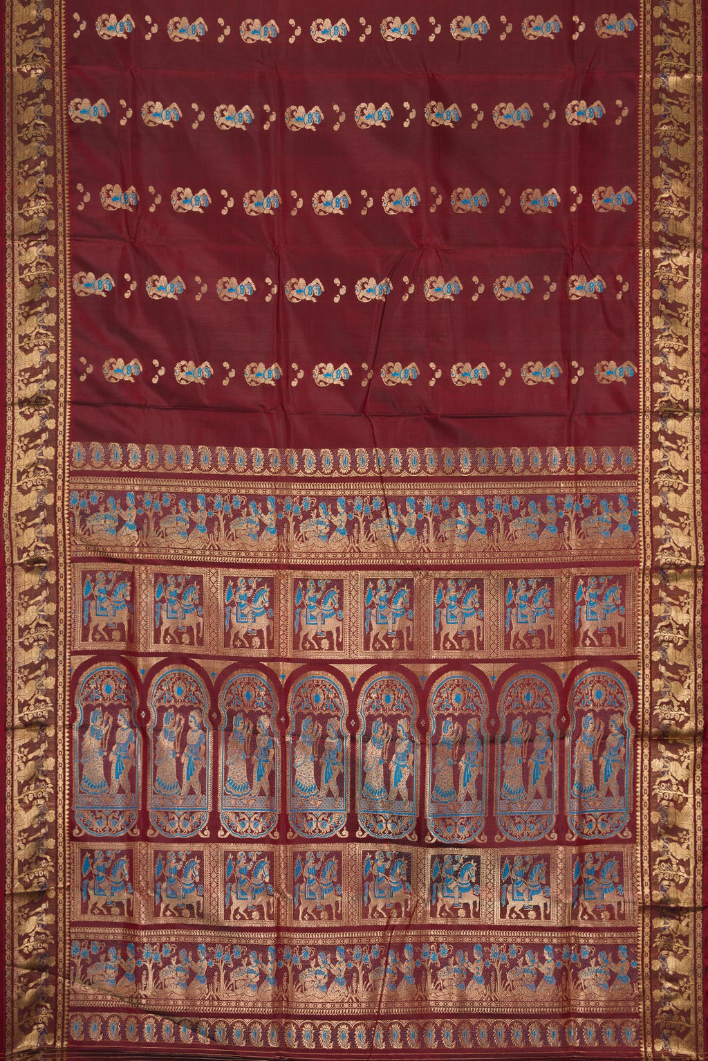 Flat view of Coffee Brown Baluchari Silk Saree with Thread Butta on the body and Zari Border. 
