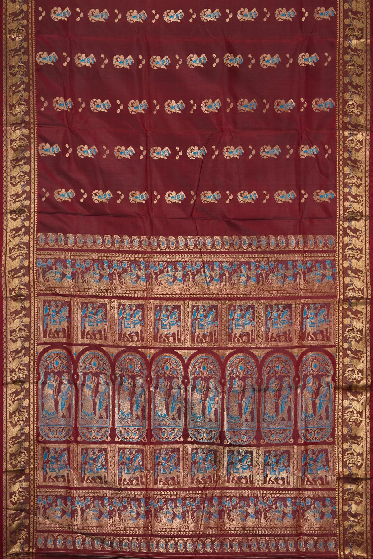 Flat view of Coffee Brown Baluchari Silk Saree with Thread Butta on the body and Zari Border. 
