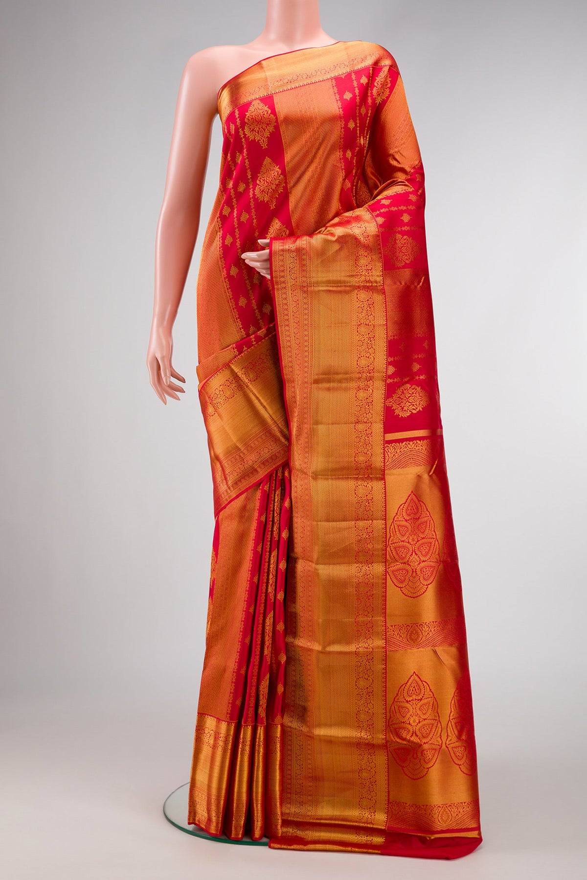 Dark Pink Dual Tone Kanjivaram Silk Saree with Zari Brocade on the body and Zari Border.  displayed on a mannequin