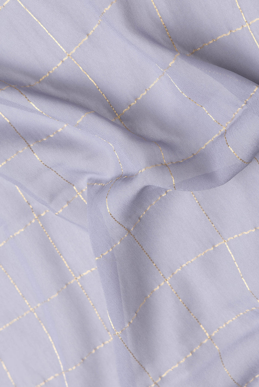 Close up of Grey Dual Tone Georgette Saree with Checked design on the body and Zari Border.  displaying folds