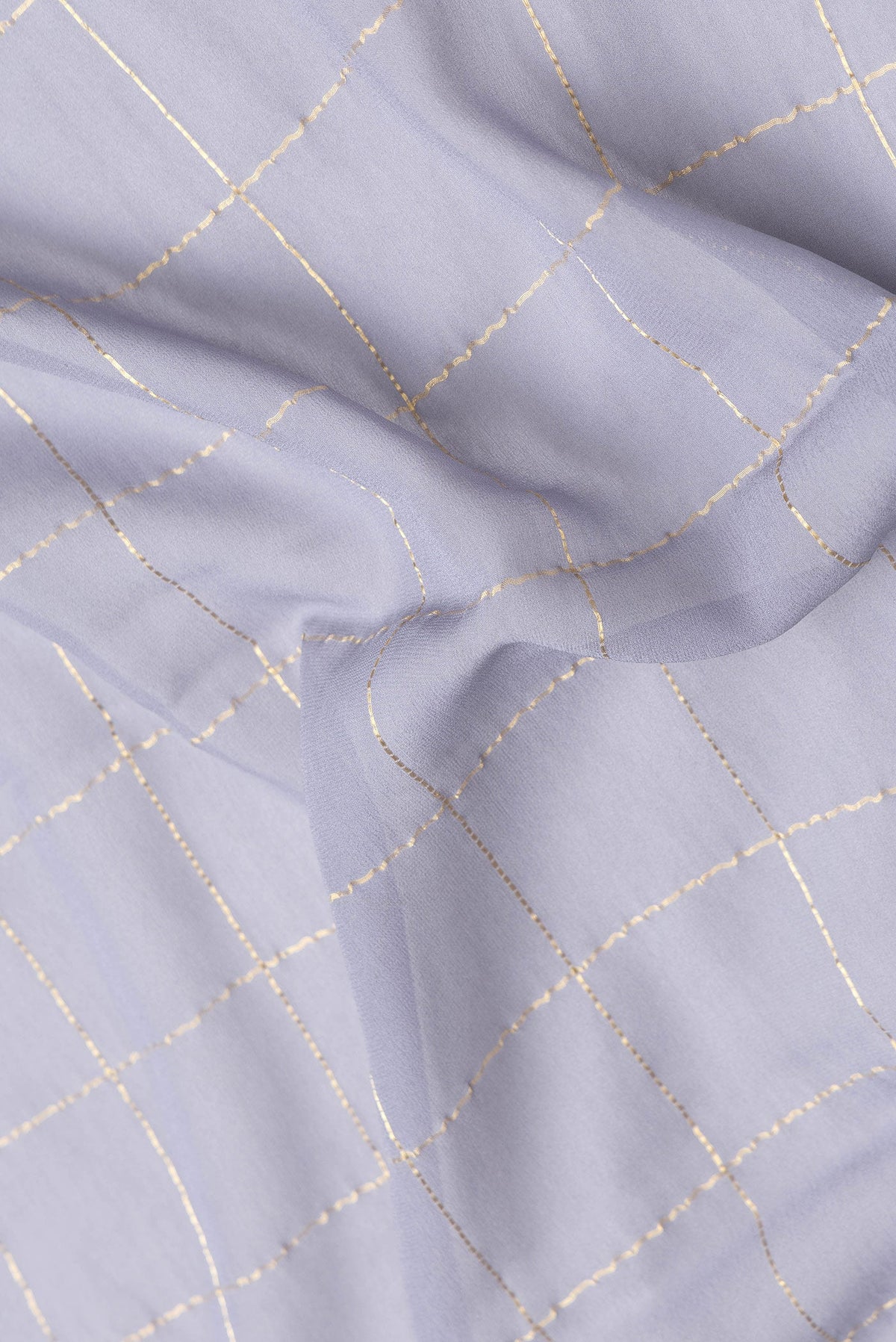 Close up of Grey Dual Tone Georgette Saree with Checked design on the body and Zari Border.  displaying folds