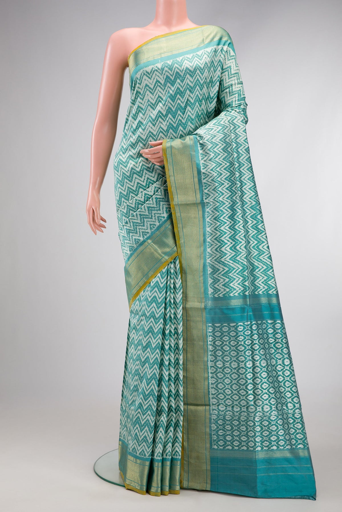 Blue Dual Tone Double Ikat Saree with Ikat Print on the body and Zari Border.  displayed on a mannequin