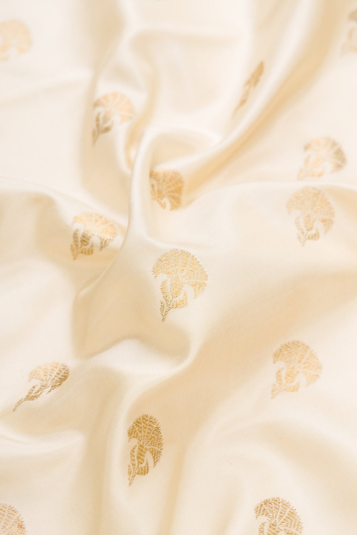 Close up of Sandal Dual Tone Double Ikat Saree with Zari Butta on the body and Paithani Border.  displaying folds