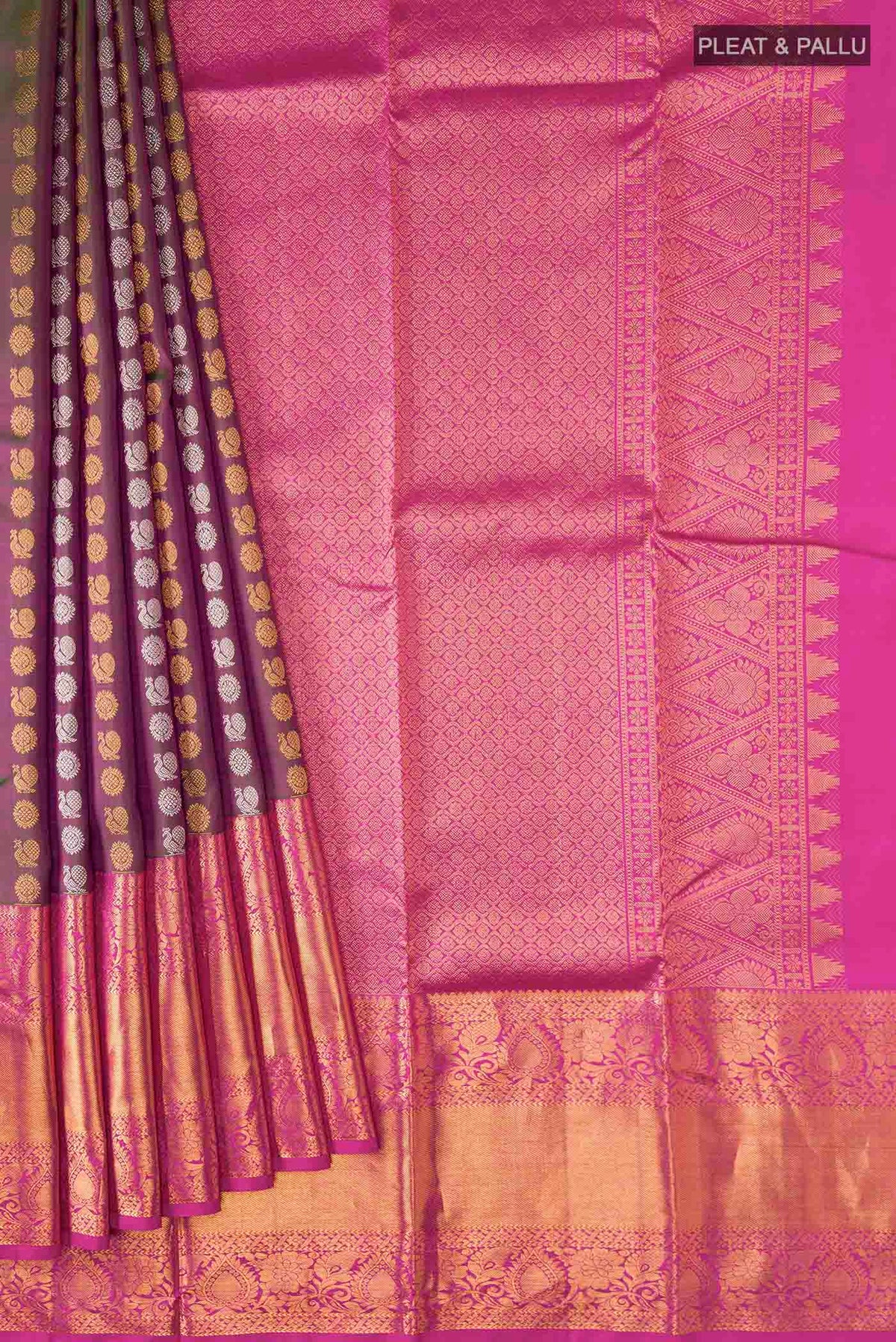 Pleats and pallu of Green with Pink Color Kanchipuram Silk Saree with Zari Butta on the body and Zari Border