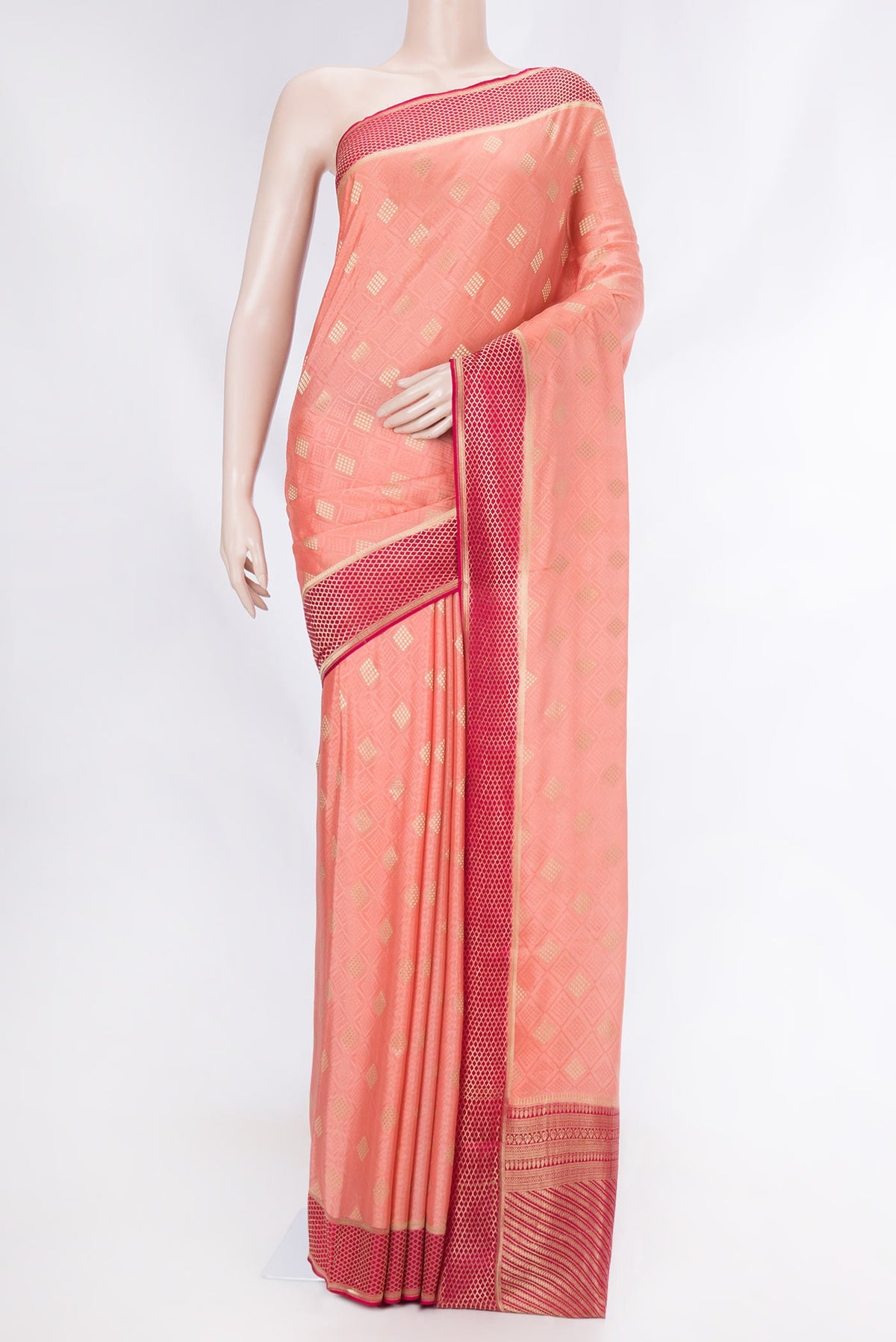 Golden Peach Dual Tone Mysore Crepe Saree with Jacquard With Zari Butta on the body and Zari Border displayed on a mannequin