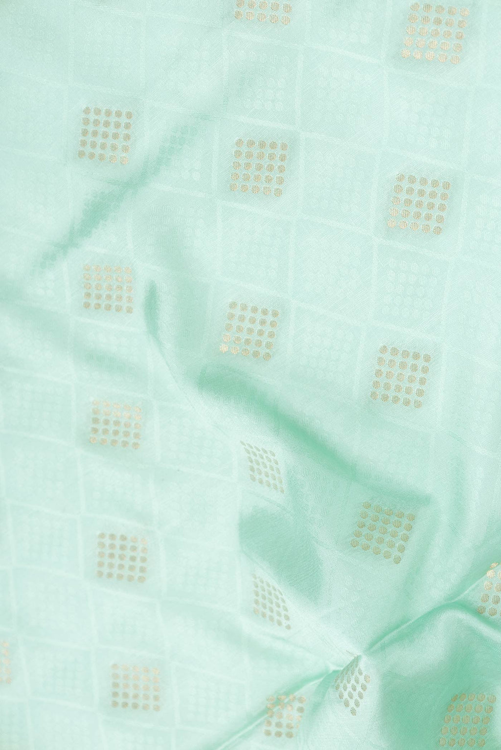 Close up of Sea Green Dual Tone Mysore Crepe Saree with Jacquard With Zari Butta on the body and Zari Border displaying folds