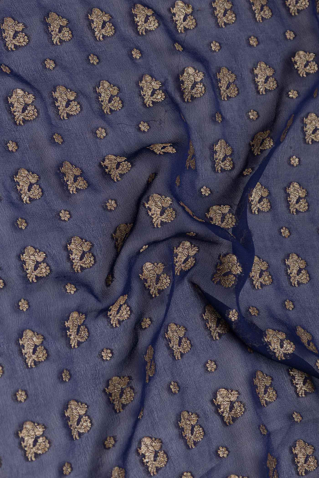 Close up of Royal Blue Dual Tone Banarasi Georgette Saree with Zari Brocade on the body and Zari Border displaying folds
