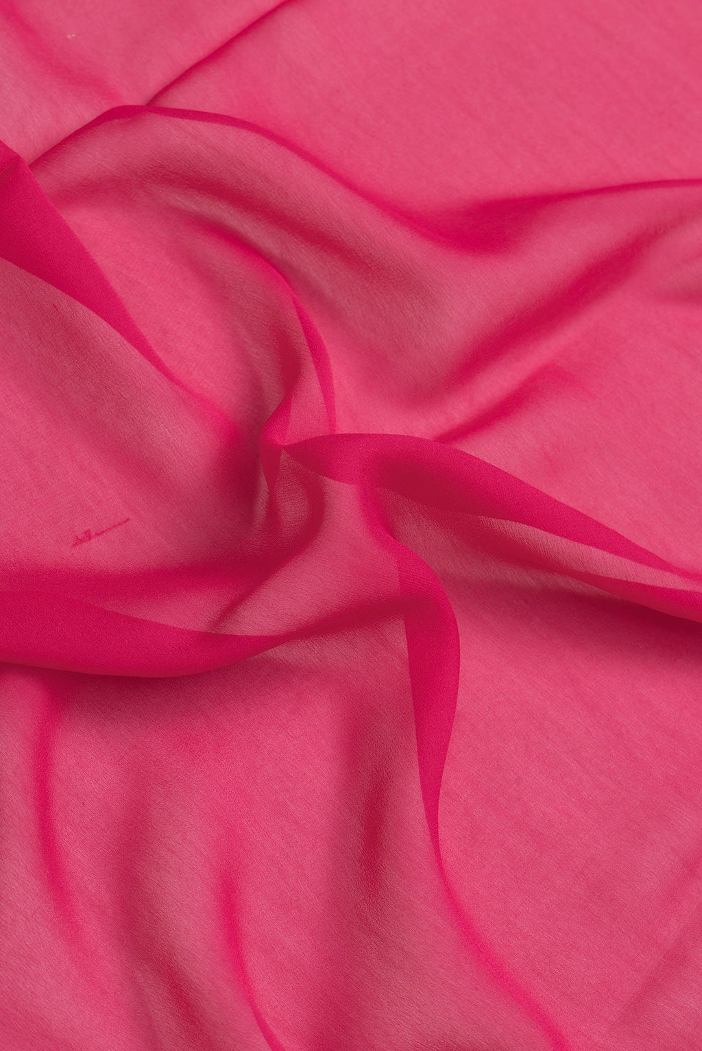 Close up of Dark Pink Dual Tone Georgette Saree with Plain Body and Zari Border.  displaying folds