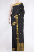 Black Dual Tone Kanjivaram Silk Saree with Zari Butta on the body and Zari Border.  displayed on a mannequin