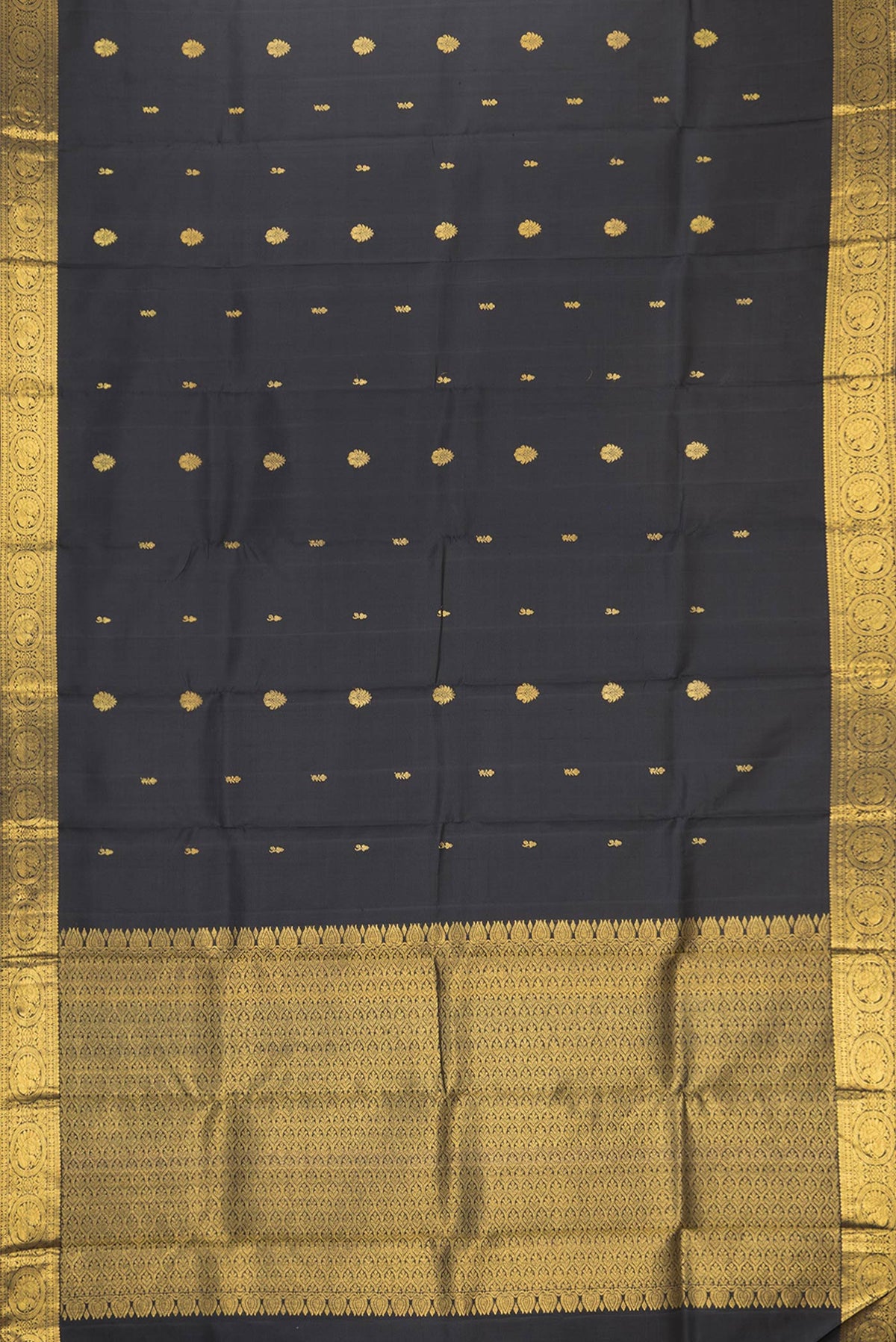 Flat view of Black Dual Tone Kanjivaram Silk Saree with Zari Butta on the body and Zari Border. 
