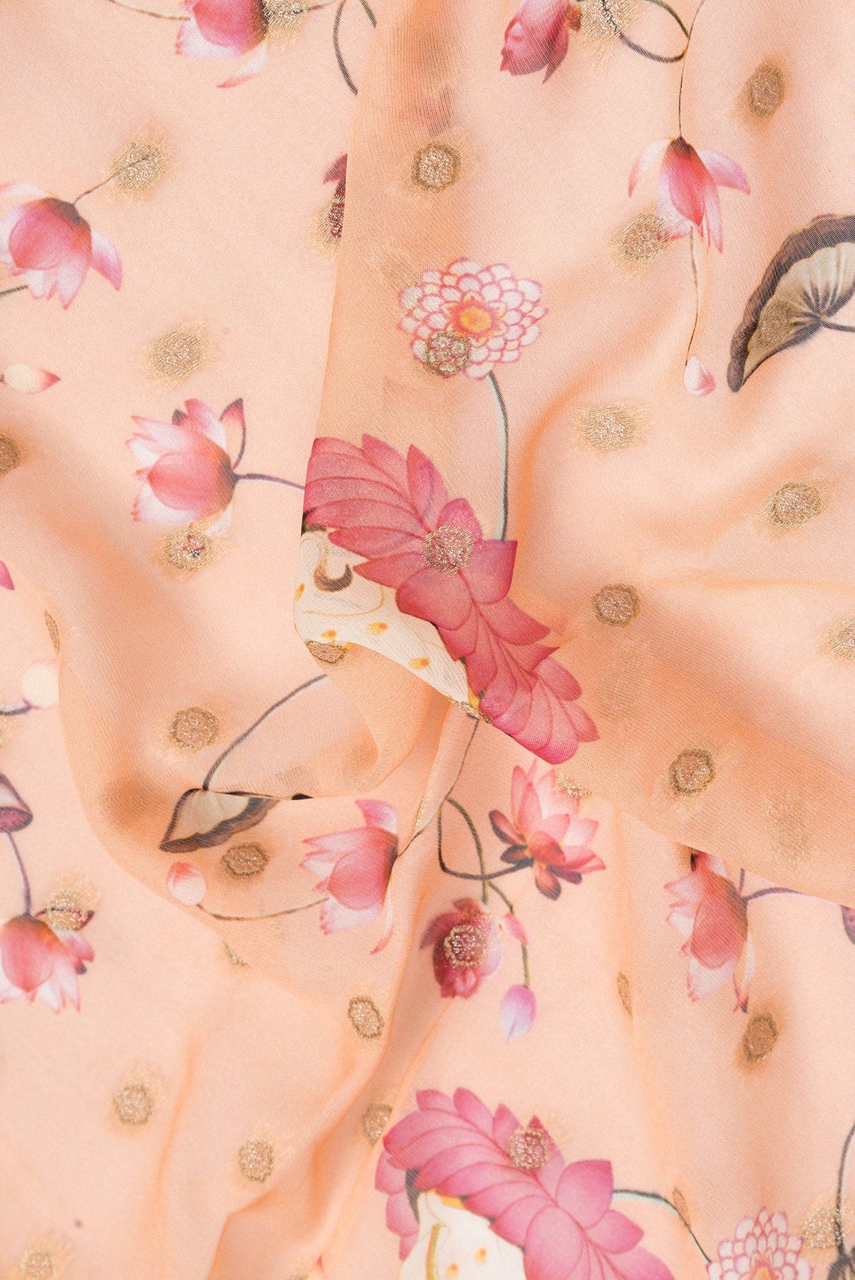 Close up of Peach Dual Tone Georgette Saree with Embroidery on the body and Embroidery Border.  displaying folds