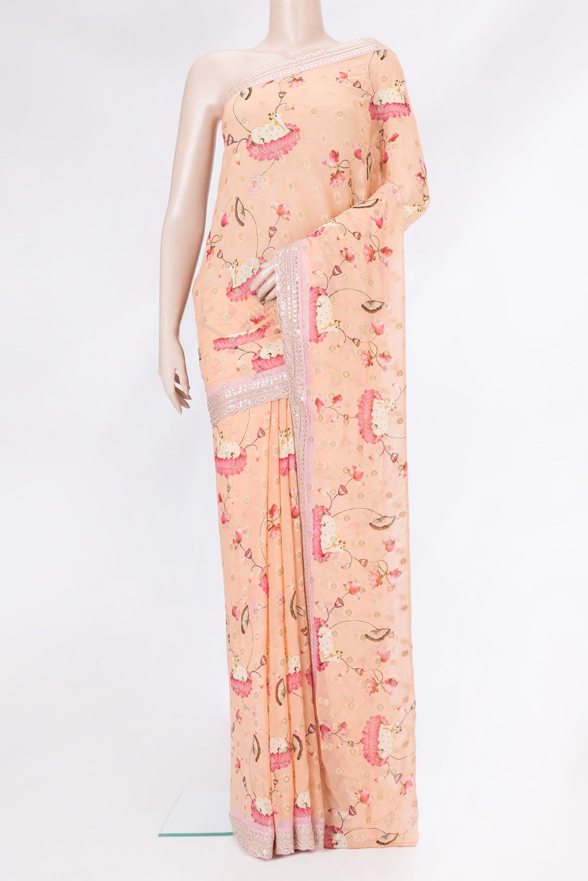 Peach Dual Tone Georgette Saree with Embroidery on the body and Embroidery Border.  displayed on a mannequin