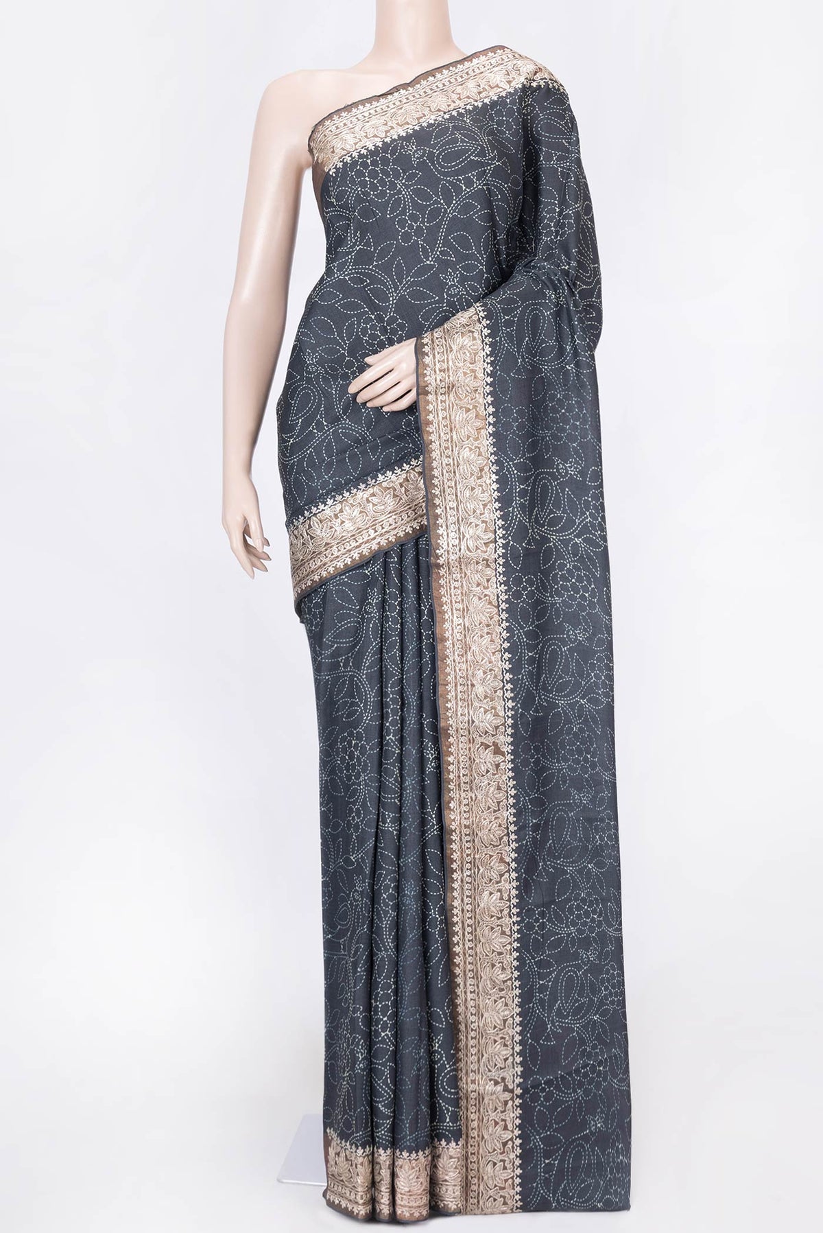 Black Dual Tone Tussar Silk Saree with Printed design on the body and Zari Border displayed on a mannequin