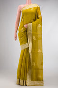 Mehandi Green Dual Tone Organza Silk Saree with Zari Butta on the body and Zari Border.  displayed on a mannequin