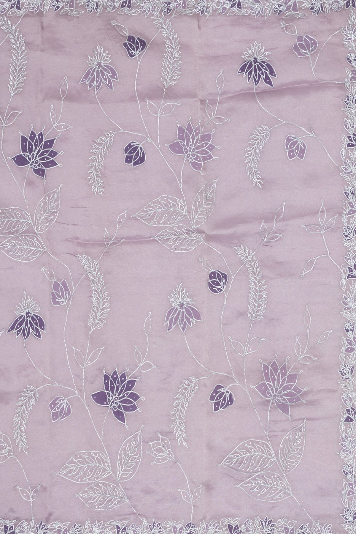 Close up image of the pallu of Lavender Dual Tone Organza Silk Saree with Embroidery on the body and Embroidery Border. 