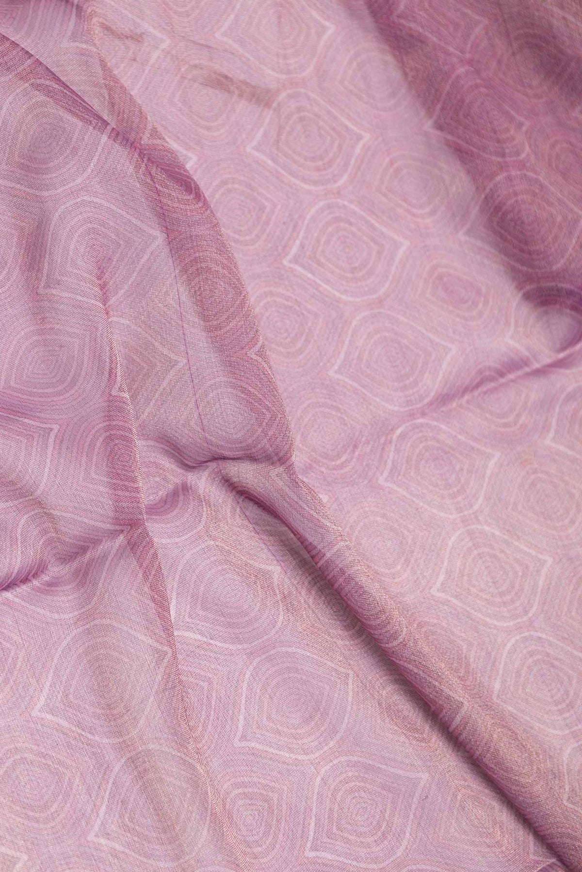 Close up of Lavender Dual Tone Mysore Georgette Saree With Printed design on the body and Printed Border displaying folds