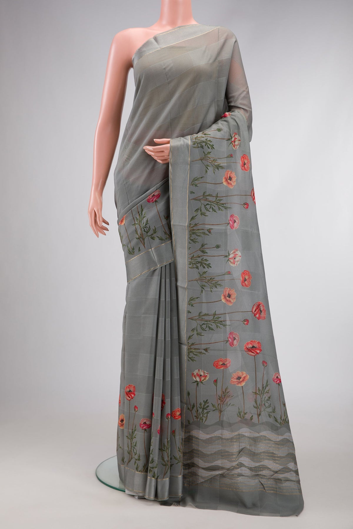 Grey Dual Tone Mysore Crepe Saree with Printed design on the body and Fancy Border.  displayed on a mannequin