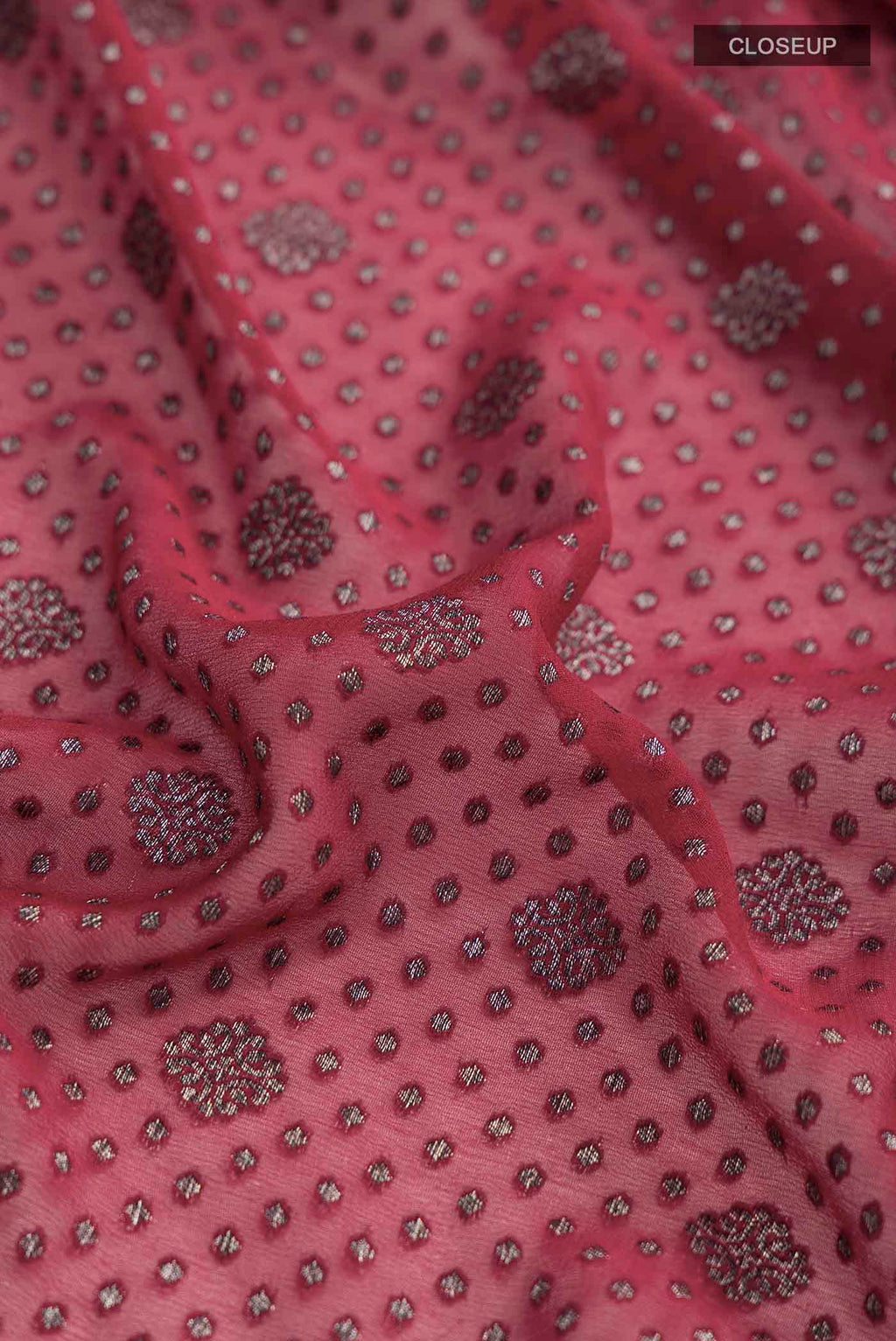 Close up of Maroon Banarasi Georgette Saree with Zari Butta on the body and Zari Border displaying folds